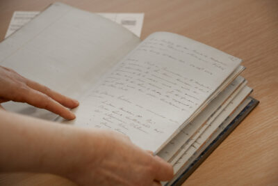 A book open showing handwritten notes