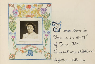 A hand written page from a book with a picture of a woman in the top left surrounded by coloured drawings of flowers.
