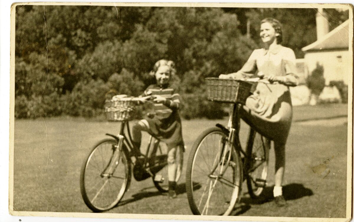 A photo of two girls riding bikes in 1939