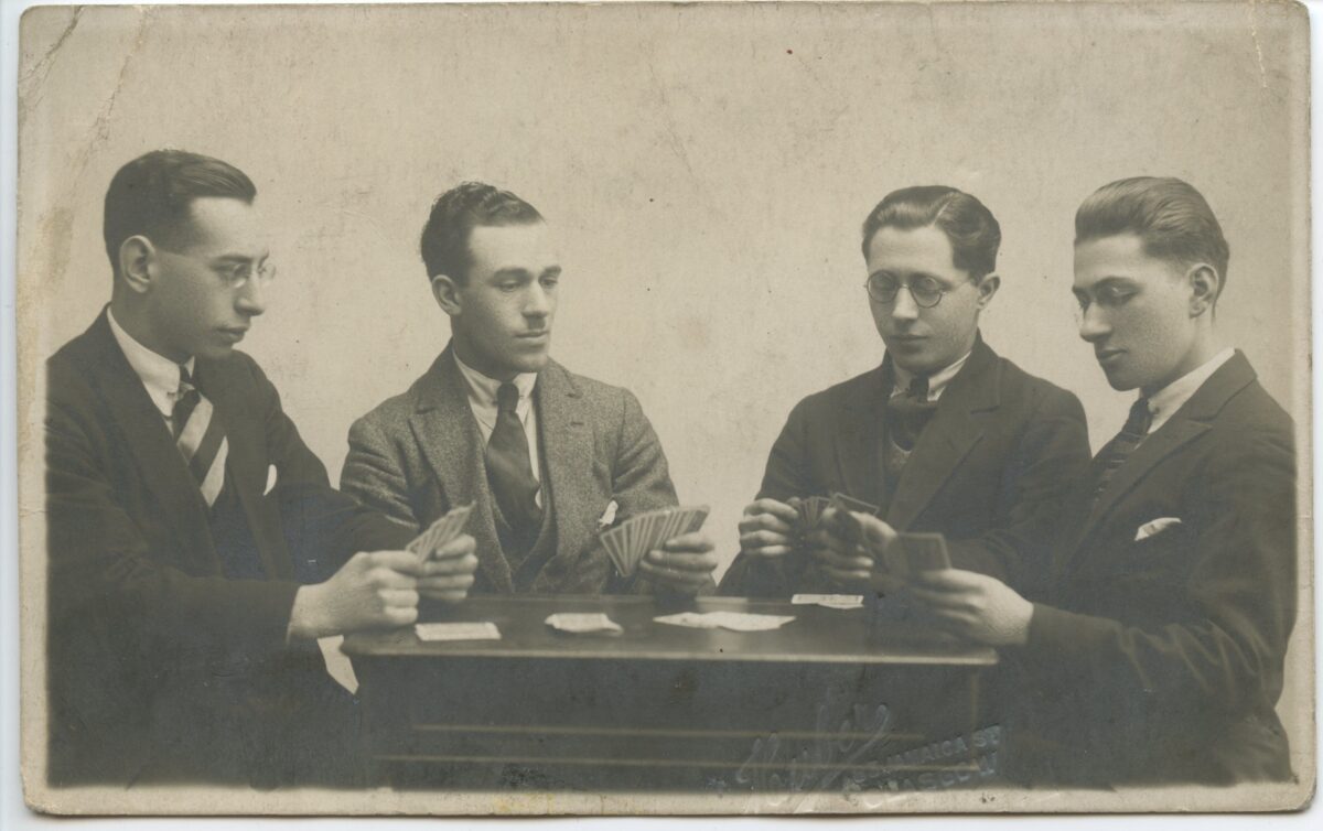 Four men playing cards from around 1930